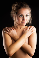 Image showing Attractive woman covering breast