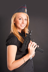 Image showing Pretty woman with a gun