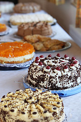 Image showing Buffet table with an assortment of cakes