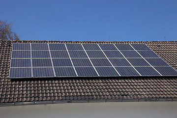 Image showing Solar panels on a house roof