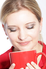 Image showing Woman enjoying a mug of coffee