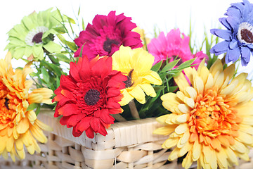 Image showing Bright summer flowers in a basket