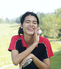 Image showing Female golf player laughing