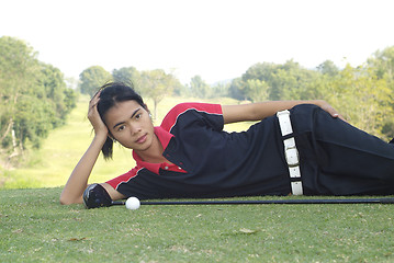 Image showing Female golf player resting