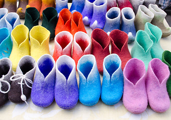Image showing colorful felt boots in market 
