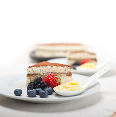 Image showing tiramisu dessert with berries and cream