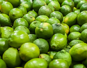 Image showing green lemon  on display at farmers market