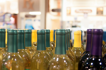 Image showing Wine bottles shot with limited depth of field on display in a li