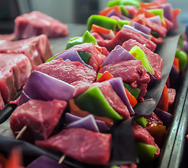 Image showing Preparing fresh beef steak shishkabobs with vegetables
