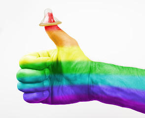 Image showing Thumbs up, condom on thumb