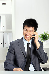 Image showing Asian Businessman Talking on Cellphone