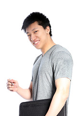 Image showing Casual Asian Man with a Binder and Pen