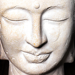 Image showing Serene face of a stone Buddha