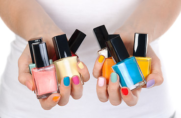 Image showing woman holding a bottle of nail polish