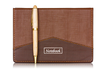 Image showing Brown notebook and pen