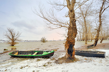 Image showing green boat on shore in winter