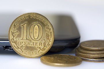 Image showing Phone and coins