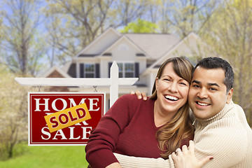 Image showing Couple in Front of Sold Real Estate Sign and House