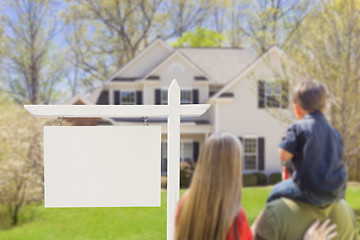 Image showing Family in Front of Blank Real Estate Sign and House