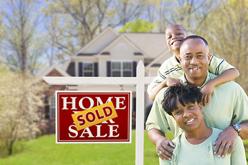 Image showing African American Family In Front of Sold Sign and House