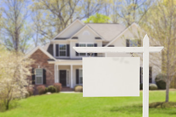 Image showing Blank Real Estate Sign in Front of New House 