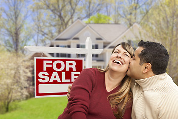 Image showing Couple in Front of For Sale Sign and House