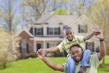 Image showing Playful African American Father and Son In Front of Home