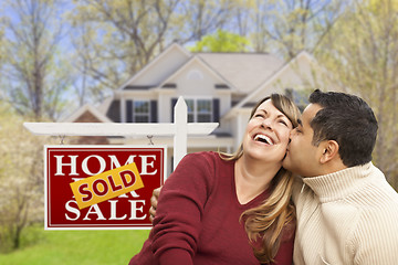 Image showing Couple in Front of Sold Real Estate Sign and House