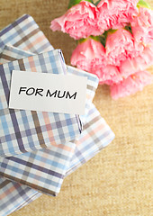 Image showing Gift and pink carnations flower for Mother's Day