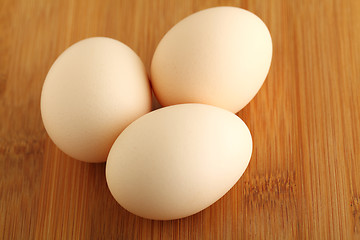 Image showing eggs on wooden background