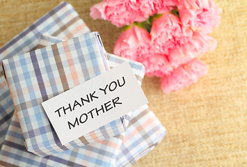 Image showing Gift and pink carnations flower for Mother's Day