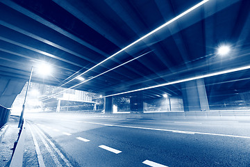 Image showing traffic light through city at night in blue tone