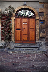 Image showing   brown door and grate  in  bellinzona 