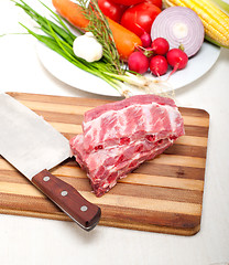 Image showing chopping fresh pork ribs and vegetables