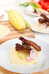 Image showing pork ribs on polenta corn cream bed