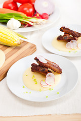 Image showing pork ribs on polenta corn cream bed