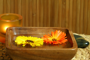 Image showing Floating marigold flowers