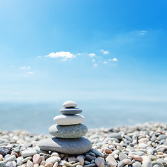 Image showing stack of zen stones over sea and clouds background