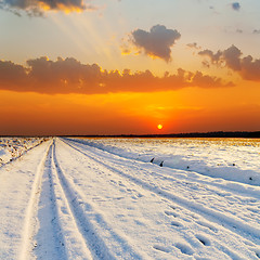 Image showing red sunset over road with snow
