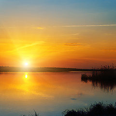 Image showing red sunset over river