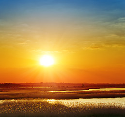 Image showing red sunset over river