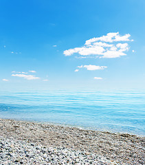 Image showing stones on beach, sea and blue sky. Crimea, Ukraine