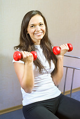 Image showing brunette girl makes physical exercise