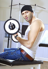 Image showing handsome man takes exercises