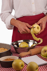 Image showing Peeling apples for pie