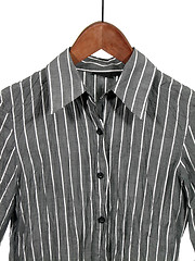 Image showing Gray striped shirt on wooden hanger