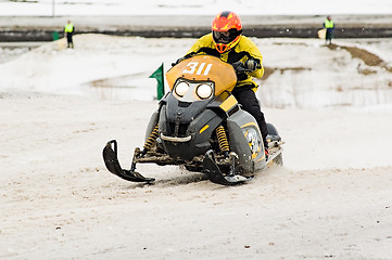 Image showing Race of ski mobile rider