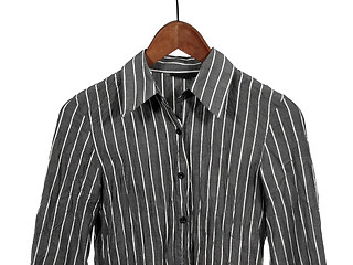 Image showing Gray striped shirt on wooden hanger, isolated