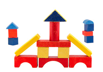 Image showing colorful wood toy brick construction on white 