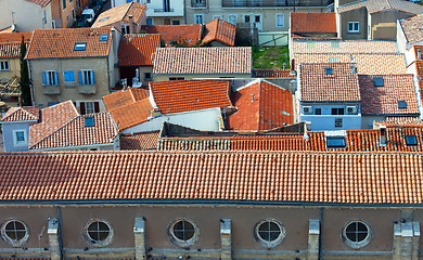 Image showing Top view on red tiled roofs